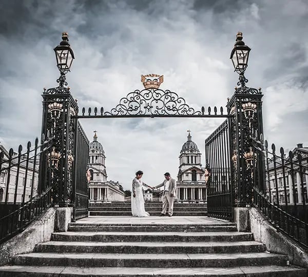 wedding couple standing on the old royal navy college steps in greenwich