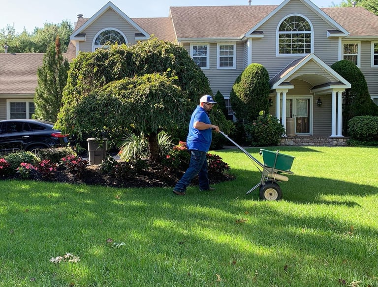 On Point Everything Inc lawn care truck and crew providing professional service in Port Jefferson St
