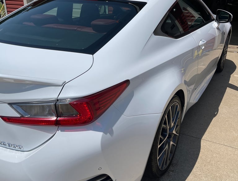 Professional auto detailing in Logan OH showing polished vehicle with mirror-like shine