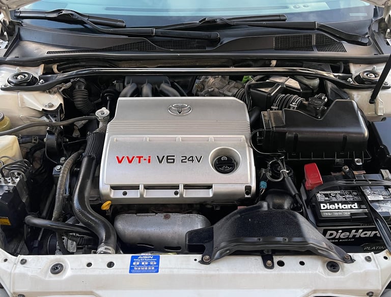 Engine bay detailing service in Logan Ohio with clean and restored components