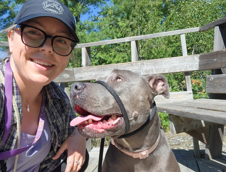 a woman with her dog on in north bay, ontario