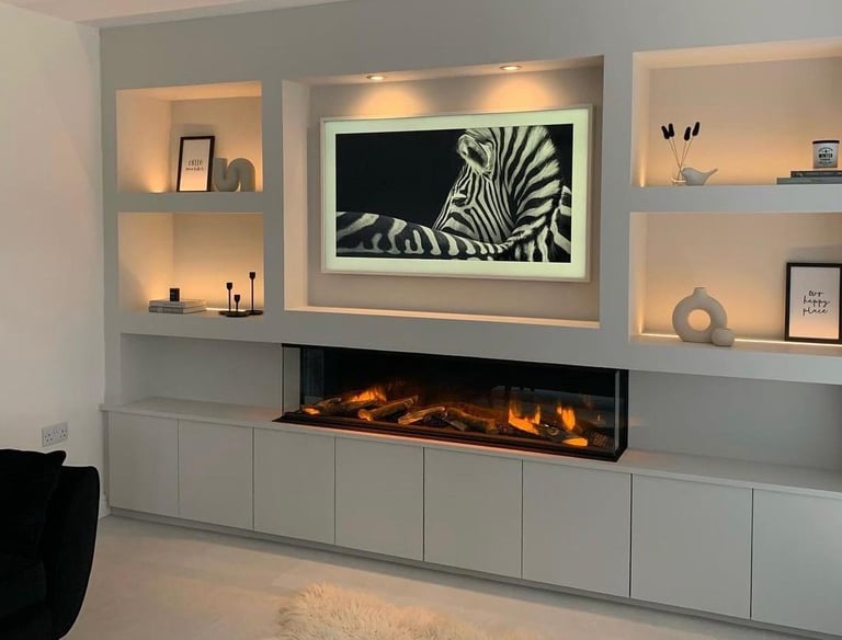 Modern media wall featuring cosy lighting and bespoke shelves