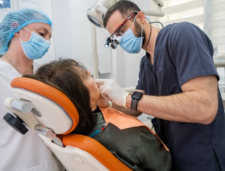 Cosmetic dentist performing veneers and dental implant treatment in Tbilisi clinic