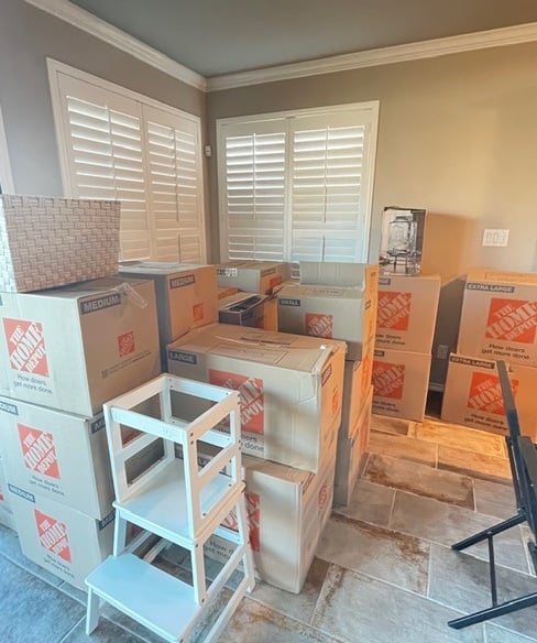 Organized moving boxes packed and labeled for a residential move