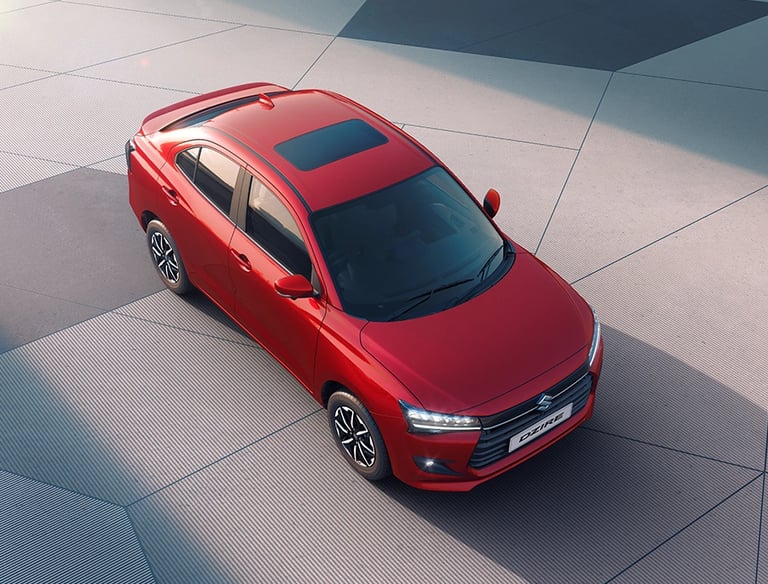 a red car parked on a tiled floor