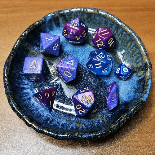 a shallow bowl of dungeons and dragons dice