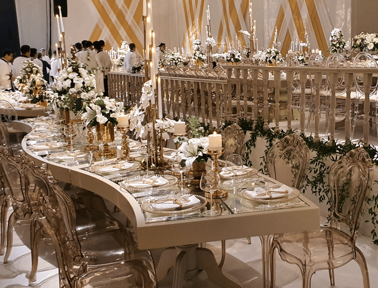 Premium wedding reception table setup with gold decor and floral design in Bodrum