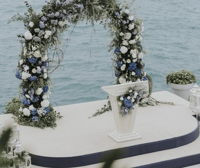 Beach wedding ceremony decoration with floral arch in Bodrum