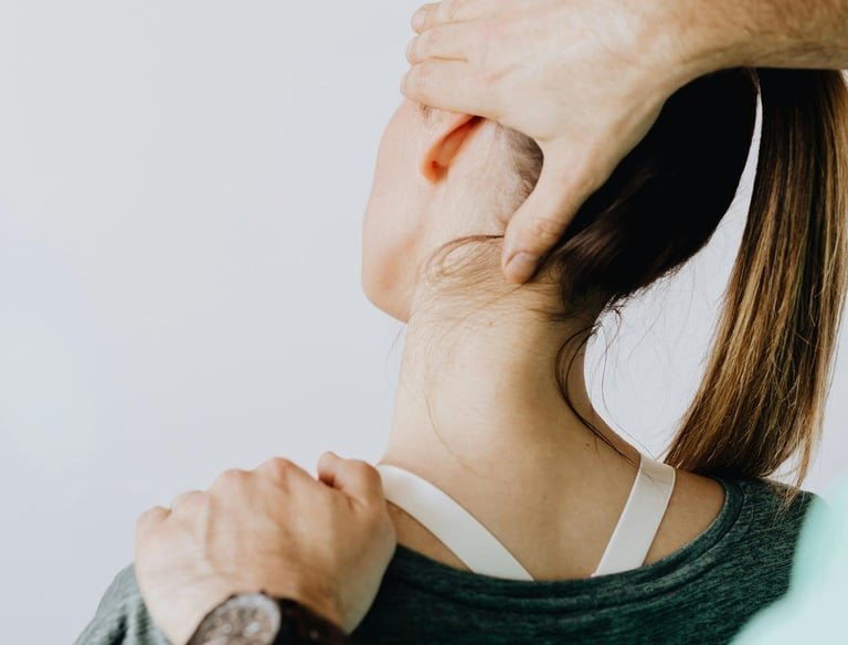 Woman getting hands on therapy to help with neck pain.