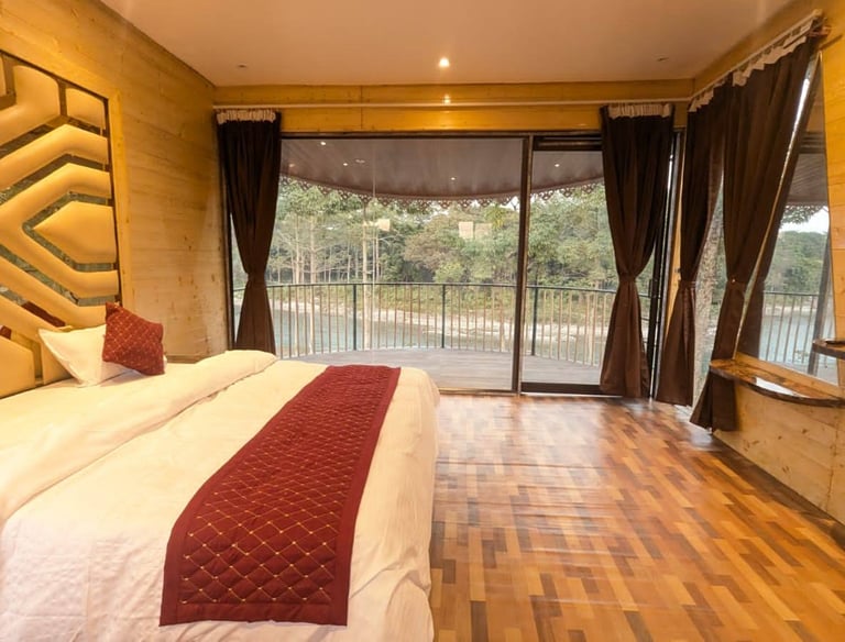 a luxury bedroom with a bed and reiver front balcony