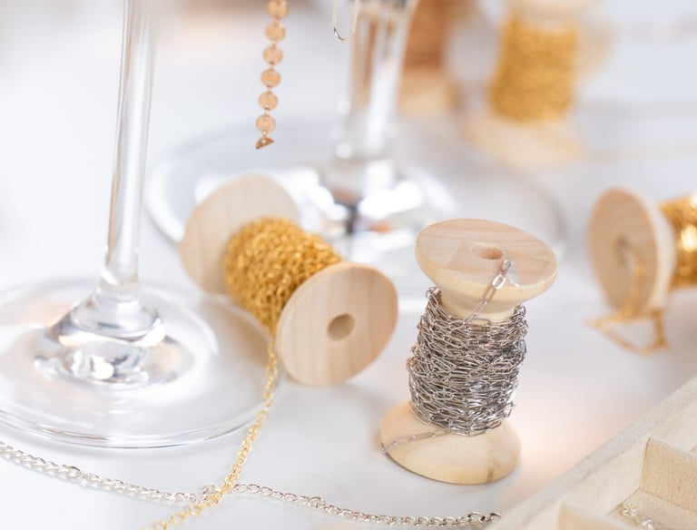 a wine glass with permanent jewelry chains