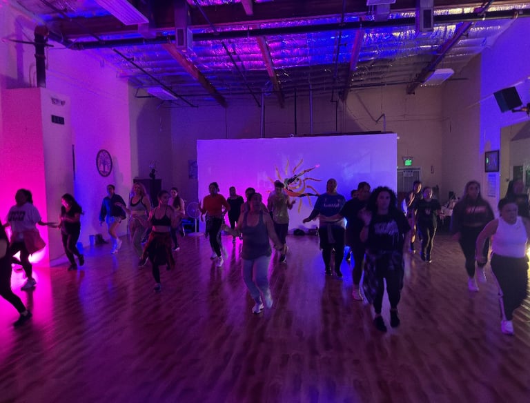 A group of dancers dancing towards the camera.