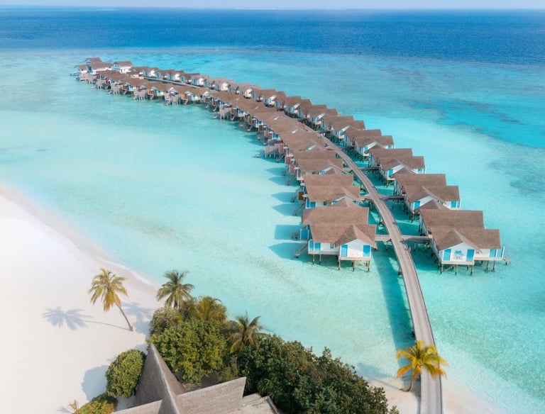 Luxury resorts in Maldives with over water villas on crystal clear lagoon