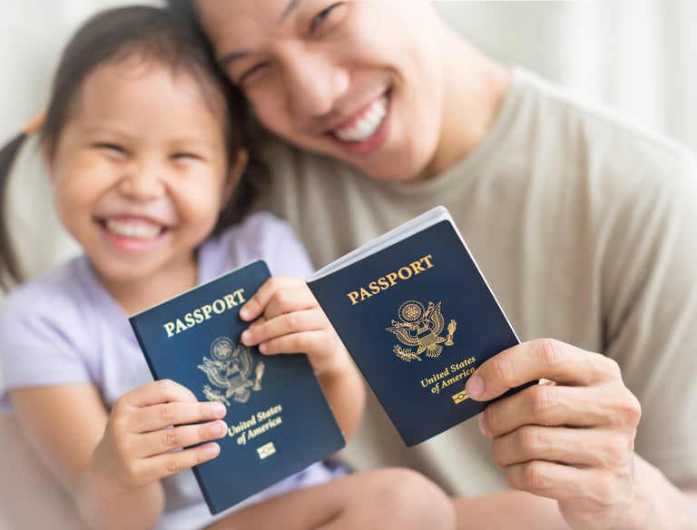 New U.S. citizens proudly holding their U.S. passports after citizenship approval.