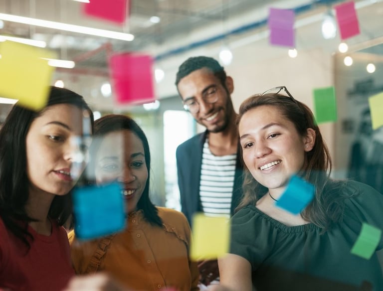 a group of people standing around a glass wall