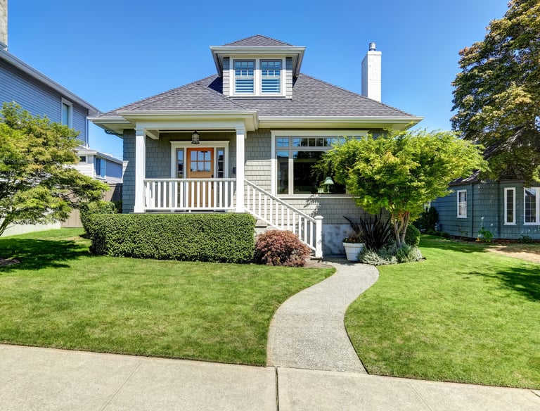 a house with a walkway and a walkway leading to a house