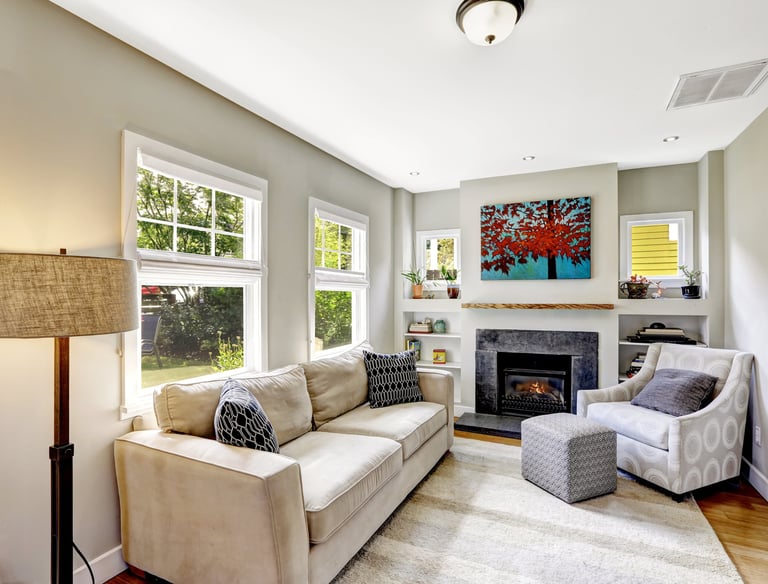 a living room with a couch and a chair