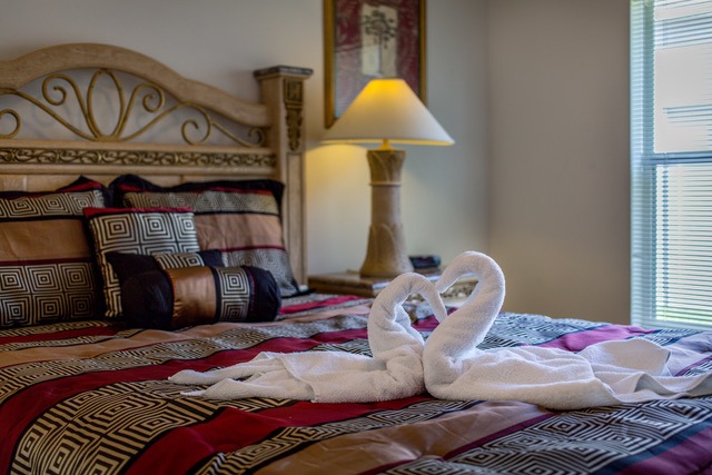 a swan towel on a bed