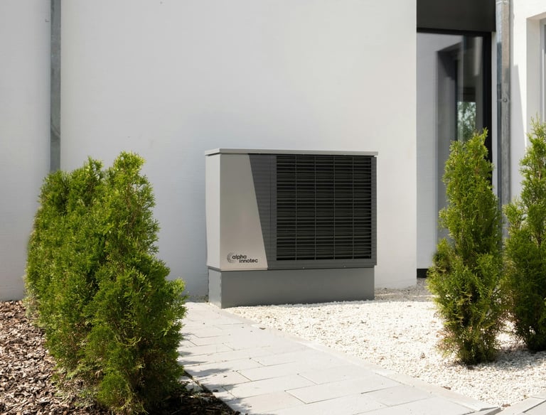 a small air conditioner sitting in front of a house