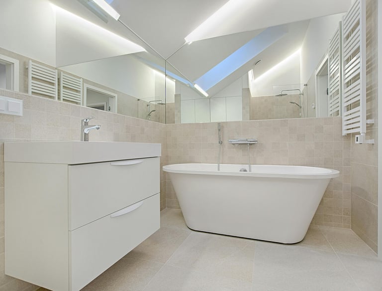 a bathroom with a bathtub and a skylight