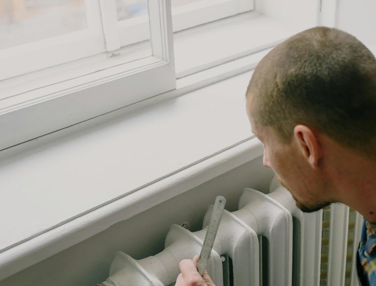 a man in a blue shirt is holding a knife and a knife in his hand