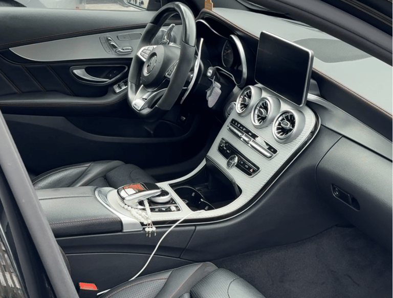 a car with a steering wheel and dashboard