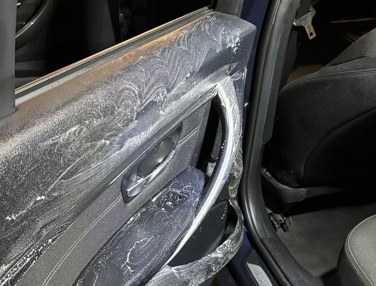 a car door with a door open and a car door open