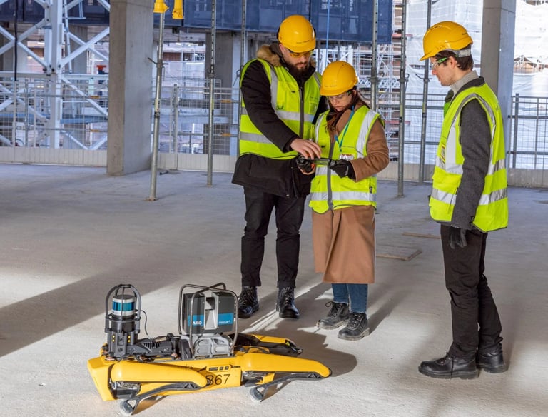 a group of people standing around a robot