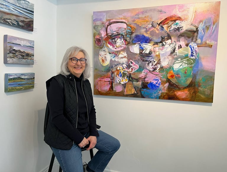 Paulette Melanson in front of her artwork at Gallery on Lincoln (photo credit: Lunenburg Barnacle)