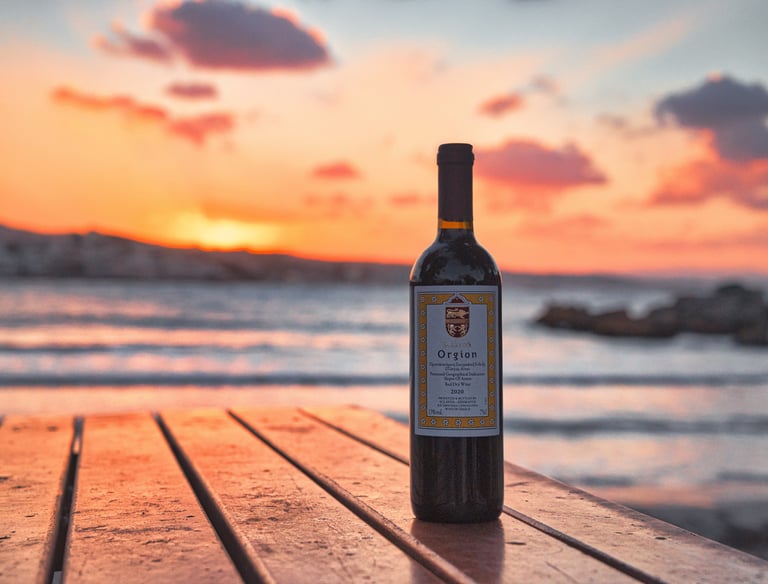 a bottle of greek red winefrom sclavos on a wooden table