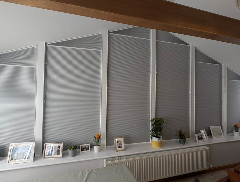 Shaped blackout honeycomb blinds fitted to angled windows in Aberdeen home