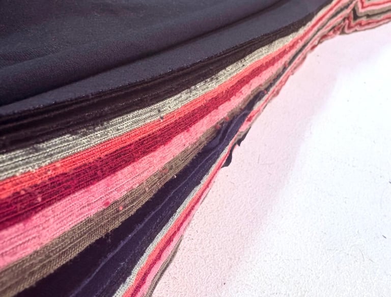 a person holding a piece of clothing with a name on it