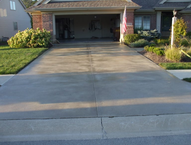 a driveway with a driveway and driveway with a flag