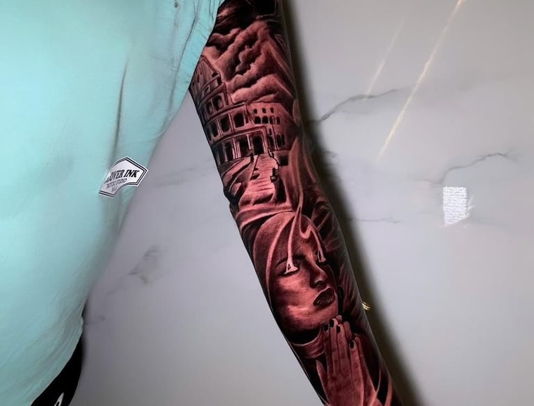 ustom full-arm sleeve tattoo on tourist at Legian studio