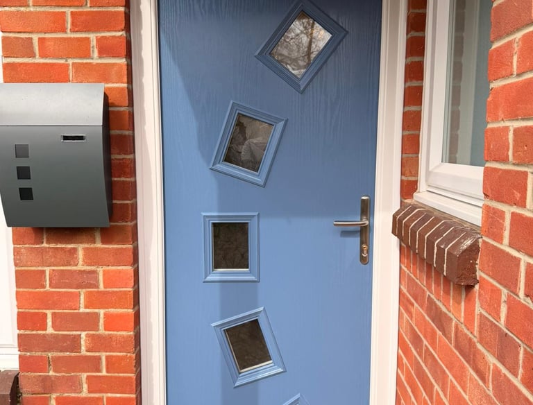 Pigeon blue front door with 5 glass panels in an arch fitted in Stubbington, Hampshire.
