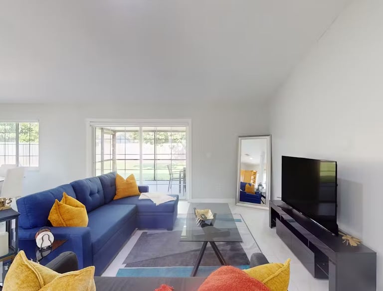 a living room with a couch and a television