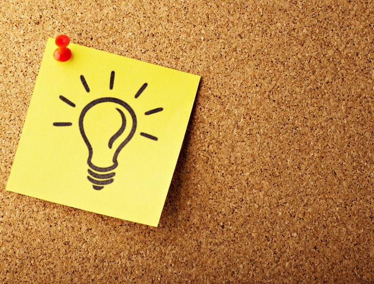 Lightbulb on a post-it, signifying an idea