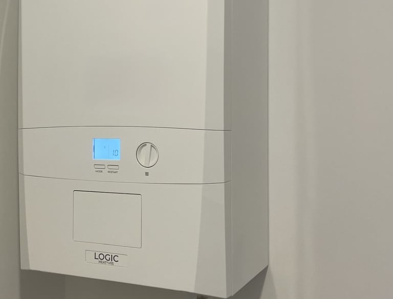 A white Ideal Logic combi boiler installed on a wall for domestic central heating and hot water.