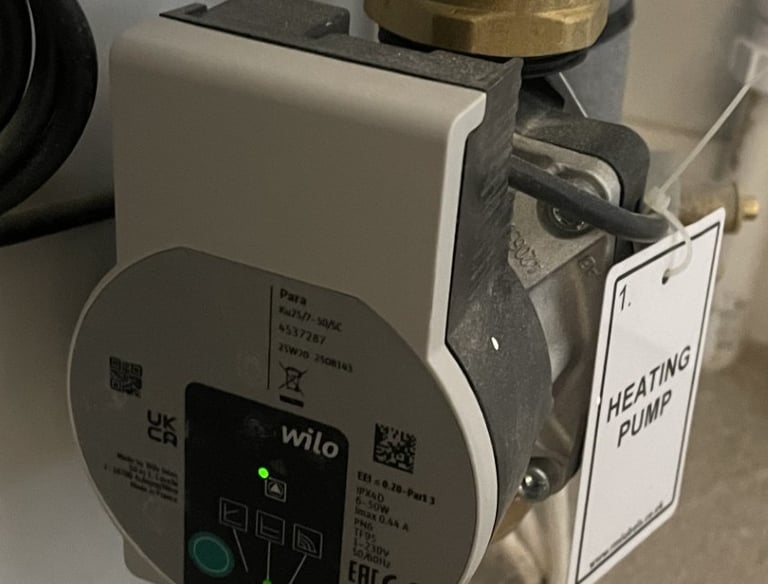 A Wilo central heating circulation pump installed on an unvented hot water cylinder..