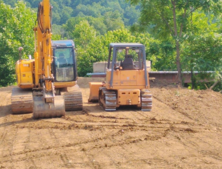 excavator and dozer getting ready to work
