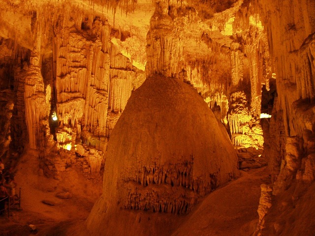 a cave with a large rock formation in the middle of it