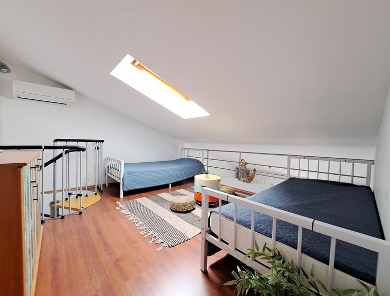 allery room with two single beds ideal for children