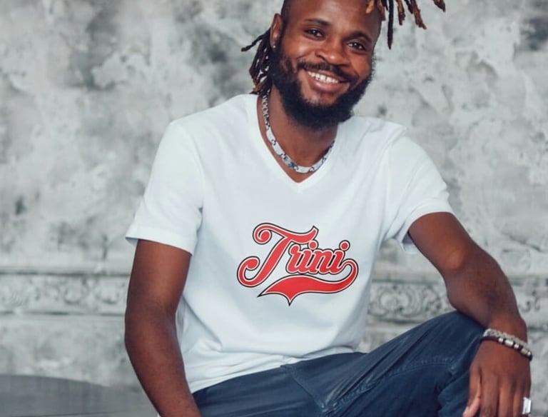 Man wearing a tshirt with the word Trini on the chest