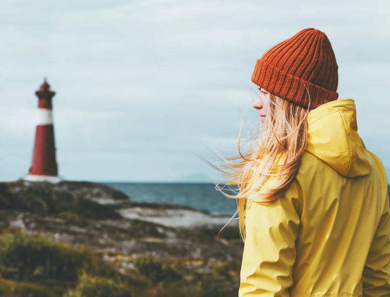 a woman in a yellow jacket and a red hat