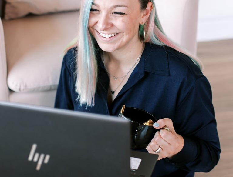 Tabitha with butterfly effect consulting talking to a client on her laptop