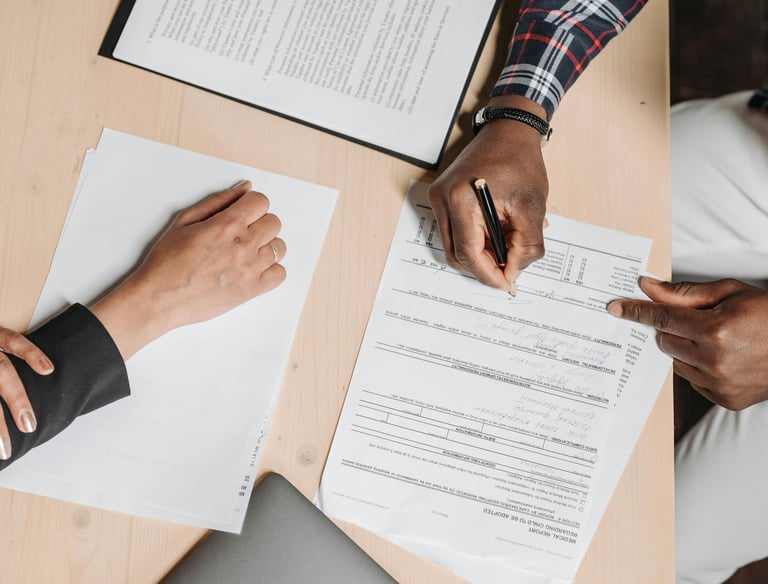 People Doing Paperwork at a Desk