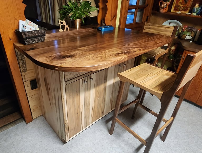 custom ambrosia maple cabinets and walnut counter top for a bar.