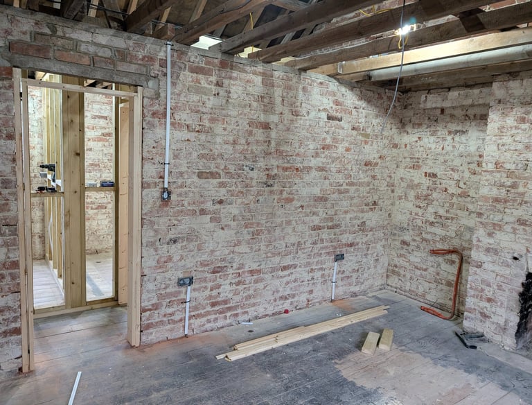 Exposed interior walls during a home renovation/electrical rewire. 1st fix completed by RAD Energise