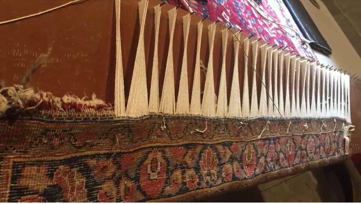 Professional rug restoration with handwoven edge and foundation repair.