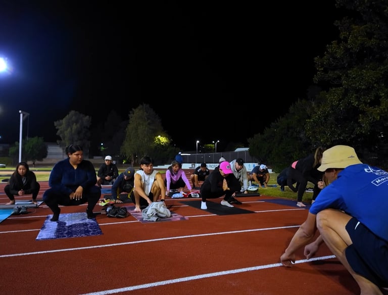 a group of people barefoot training on a track with Ray Z Unstoppable